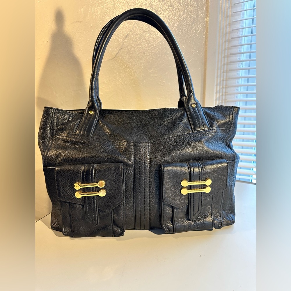 Great condition. Lauren Ralph black pebbled leather tote bag with gold hardware.
